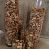 Six glass cylinders full of wine corks. Cylinders vary in size - 2