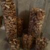 Six glass cylinders full of wine corks. Cylinders vary in size - 3