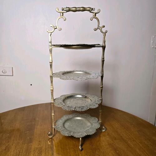 Vintage Four-Tier Metal Plate Stand with Ornate Floral-Embossed Plates