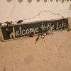 "Welcome to the Lake" Wooden Wall Sign with Fishing Bobbers, 33" x 6"