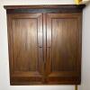 Wall-Mounted Solid Wood Cabinet with Paneled Double Doors and Rope-Twist Molding