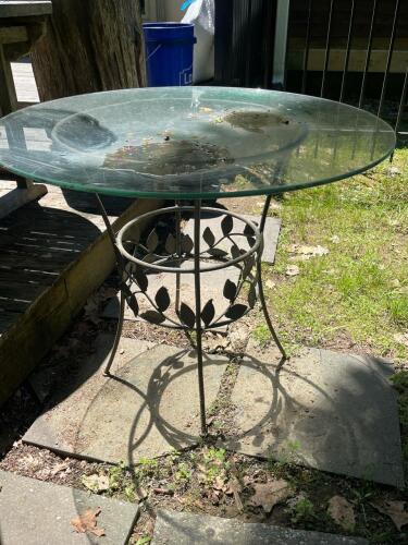 Round Glass Outdoor Patio Table with Ornamental Metal Leaf Base