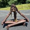 Large African Folk Art Hand-Carved Wooden Seated Tribal Figure with Braided Hair