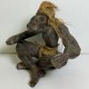 Hand-Carved Wooden Tribal Figure With Fiber Skirt and Hair