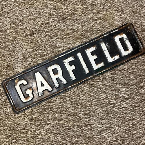 Vintage Embossed Metal Sign "Garfield"