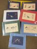 Various sized 5.7 & 7.5 x 12 Merilyn Markham Folk Art Papercut Matted Prints, Americana Motifs w/wooden board