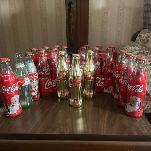 Coca-Cola Holiday Santa Bottles Lot with Trio of Gold Bottles
