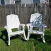 Pair of Off-White Plastic Adirondack Rocking Chairs with Contoured Seats and Wide Armrests