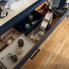 Drawer Lot: Assorted Candles, Candle Holders, and Matches with Linens
