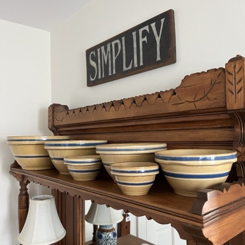Set of Yellow Ware Bowls with Blue Bands and "Simplify" Wooden Sign