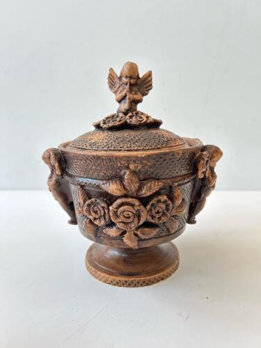 Carved Wooden Lidded Vessel with Cherub Motifs