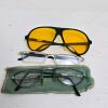 Three Pairs of Eyeglasses and Sunglasses