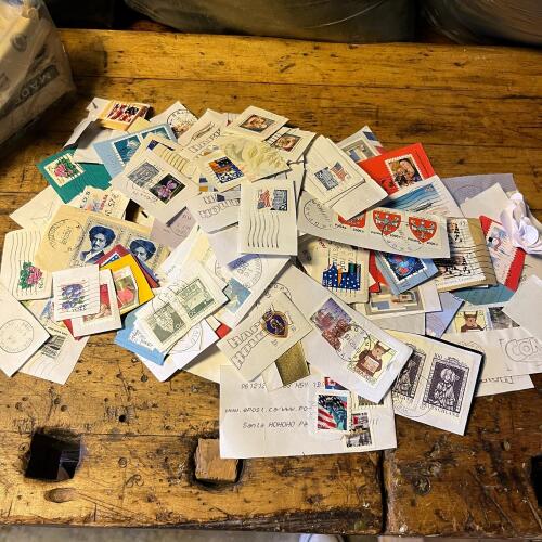 Assorted Vintage Used Postage Stamps on Paper