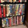 Large Assorted Family VHS and DVD Movies Lot with Stands - 8