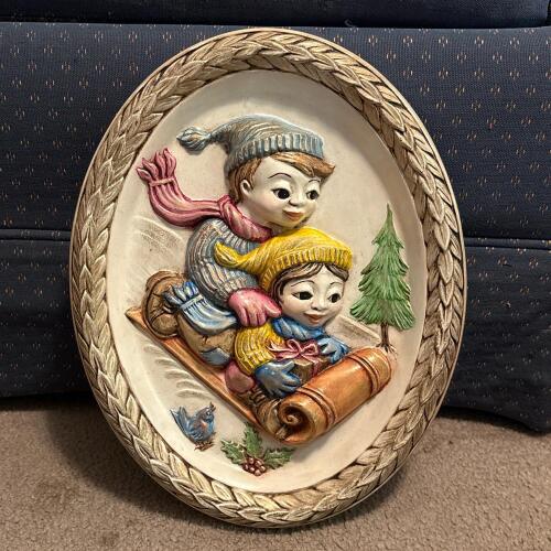 9.5" x 12" Oval Plaster Plaque Sledding Scene by B. Lewis