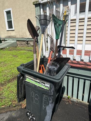Assorted Lawn Tools in Trash Bin