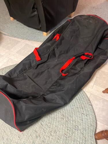 Black Rolling Equipment Bag with Red Straps