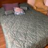 Green Damask Bedspread with Floral and Accent Pillows