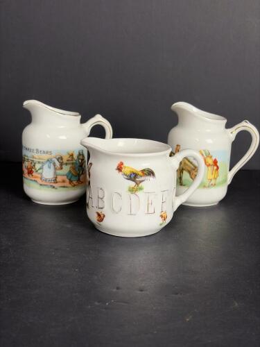 Set of Three Nursery Rhyme Porcelain Pitchers