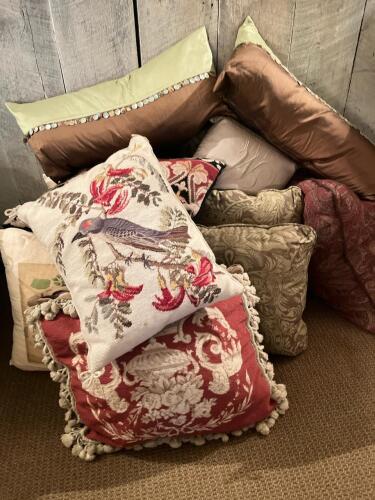 Assorted Decorative Throw Pillows in Various Sizes and Fabrics