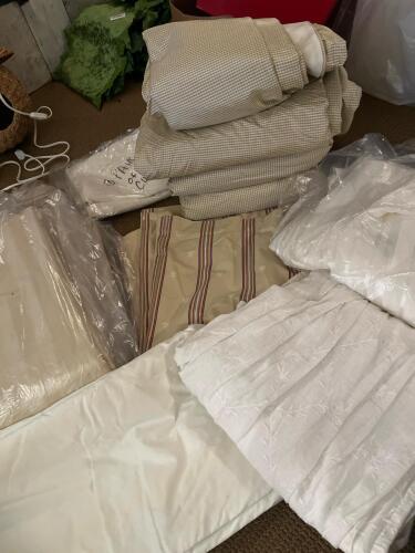 Assorted Drapery Panels and Curtains in Mostly Neutrals