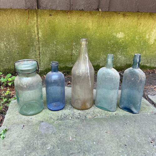 Four Vintage Glass Bottles and a Jar