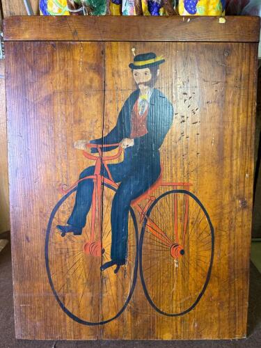 Folk Art Painted Wood Panel With Man on Bicycle