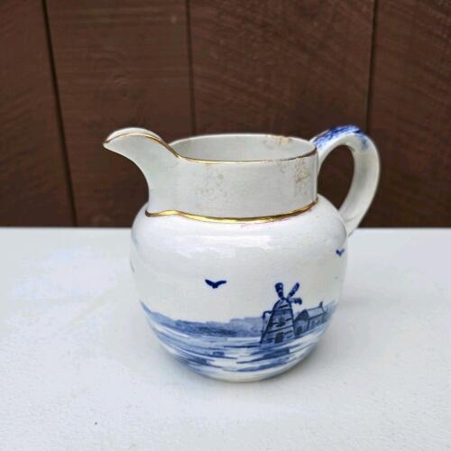 Blue and White Ceramic Pitcher With Gilt Rim, Windmill Motif