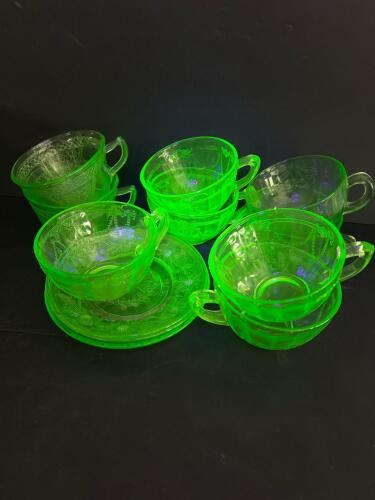 Green Depression Uranium Glass Cups and Saucers Featuring Assorted Patterns