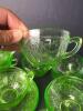 Green Depression Uranium Glass Cups and Saucers Featuring Assorted Patterns - 6