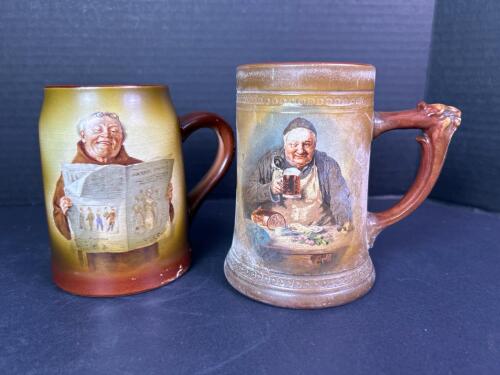 Pair of Vintage Pottery Handled Character Beer Steins