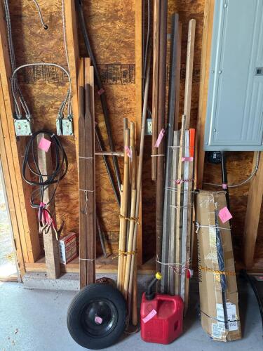 Mixed Utility Handles, Stakes, and Scrap Wood Bundle with Gas Cans and Storage