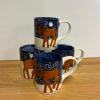 Four Signed Ceramic Moose Mugs