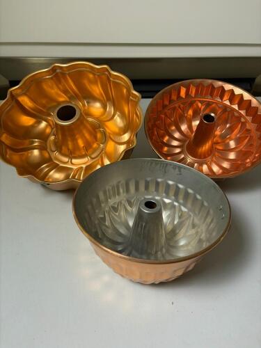Trio of Copper Bundt Pans with Decorative Fluted Designs