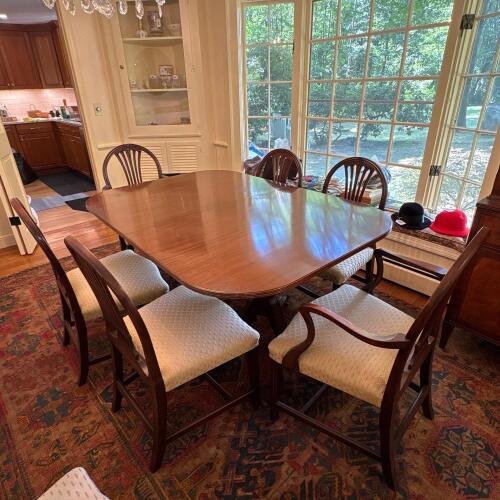 Double-Pedestal Dining Table with Eight Upholstered Chairs and Leaves