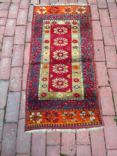 Handwoven Wool Rug With Geometric Floral Motif