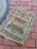 Braided Oval Rug and Small Worn Geometric-Patterned Rug - 2