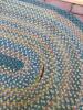 Braided Oval Rug and Small Worn Geometric-Patterned Rug - 4