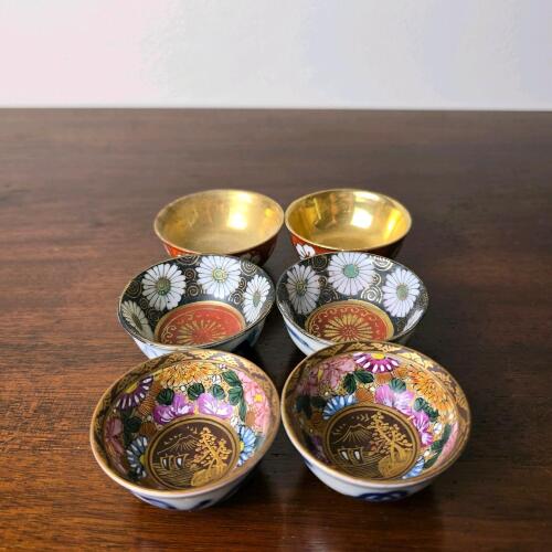 Japanese Porcelain Sake Cups with Floral and Gilt Designs