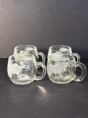 Four Glass Mugs with World Map Design by The Nestl&eacute; Co.