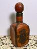 Leather-Clad Glass Decanter With Embossed Design