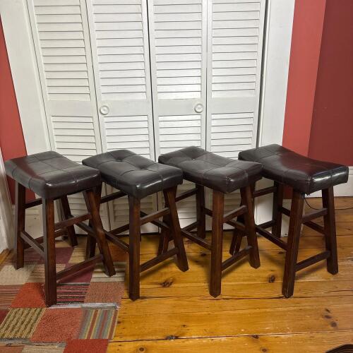 Four Backless Brown Faux Leather Counter Stools