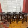 Four Backless Brown Faux Leather Counter Stools