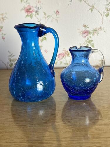 Two Cobalt Blue Crackle Glass Pitchers