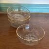 Four Clear Glass Dessert Bowls With Gold Rim and Floral Base Detail