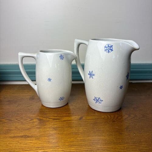 Pair of Stoneware Pitchers With Blue Snowflake Motif