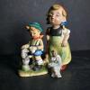 Pair of Arnart Figurines with Boy, Girl, Dog and Oriental Figure