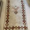 Handwoven Wool Rug with Geometric Border Design