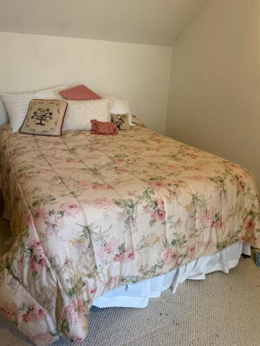 Full Size Temperpedic Mattress with Bedding and Vintage Pillows.