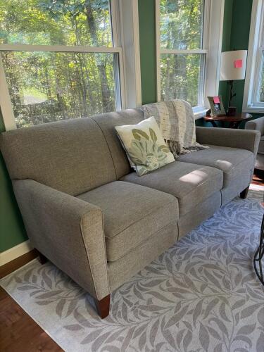Modern Three-Cushion Sofa in Gray With Blanket